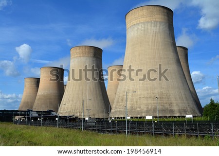 Coal fired power station cooling towers against summer sky