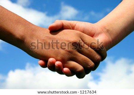 A handshake between an Indian lady and white boy symbolising friendship across gaps of race, age and gender