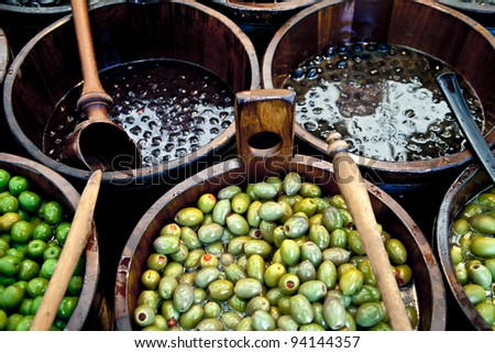 Sales of traditional products -Mediterranan olives- in the market and selected market Viktualienmarkt, Munich, Germany