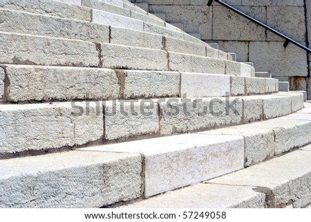 grand staircase in white and pink stone with regular steps and processed