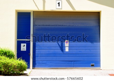garage and store small craft company with blue gate