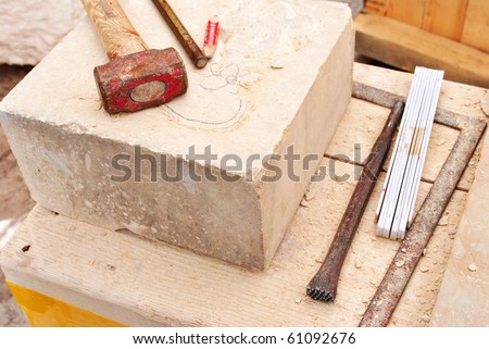 stock-photo-tools-for-working-stone-hammer-chisel-61092676.jpg
