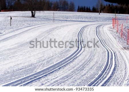 wintry landscape scenery with modified cross country skiing way. Bondone mountain in Trentino. Italy