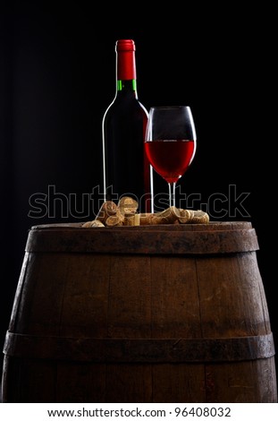 still life with red wine on old barrel