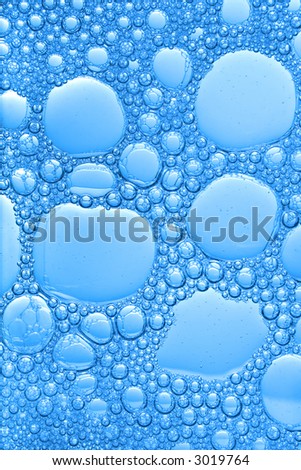background of big and small blue bubbles forming a beautiful ornament