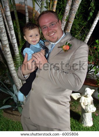 Father and baby son portrait with formal attire