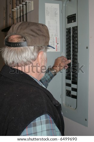 Man working on electrical box