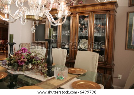 Fancy dining room with cabinet full of crystal