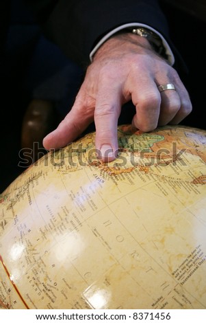 Business man hand pointing at Japan on Globe