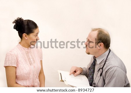 Doctor giving consultation or results to hispanic woman