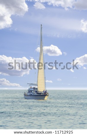 Sailboat in sailing on wide open ocean