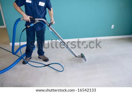 Professional Carpet Steam Cleaner Vacuuming a Home