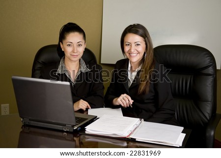 Two women having a meeting at a conference table