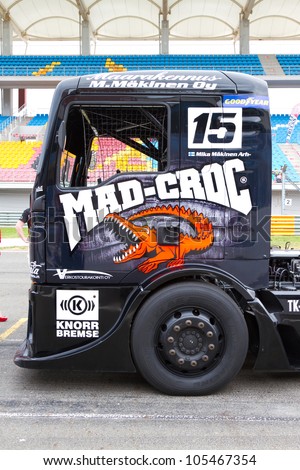 ISTANBUL - MAY 12: Mika MÃ?Â¤kinen of MAN Mad-Croc Truck Racing team at start grid before 2nd Race of 2012 FIA European Truck Racing Championship, Istanbul Park on May 12, 2012 in Istanbul, Turkey.