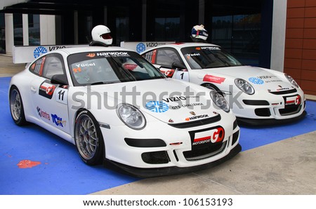 ISTANBUL - MAY 13: Yucel Ozbek (11) and Yadel Oskans (1) Porsche 997 GT3 cars at pit lane after 2nd race of 2012 Vizio GT3 Challence, Istanbul Park on May 13, 2012 in Istanbul, Turkey.
