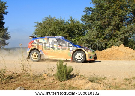 ISTANBUL - JUNE 10: Murat Bostanci drives a Castrol Ford Team Turkiye Ford Fiesta S2000 car during 33th Istanbul Rally championship, Yesilvadi Stage on June 10, 2012 in Istanbul, Turkey.
