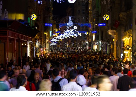 ISTANBUL, SEPTEMBER 01 : People on Istiklal Street at night on September 01, 2012 in Istanbul, Turkey. Istiklal Street is the most popular destination of Istanbul for shopping and entertainment.