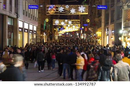 ISTANBUL, MARCH 30 : People on Istiklal Street at night on March 30, 2013 in Istanbul, Turkey. Istiklal Street is the most popular destination of Istanbul for shopping and entertainment.