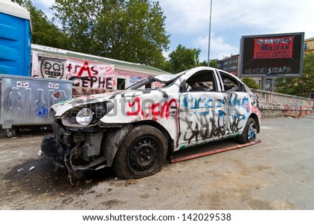 ISTANBUL - JUNE 08: Damaged car during protests on June 08, 2013 in Istanbul, Turkey. Police used disproportionate force to protesters at Taksim in first three days.