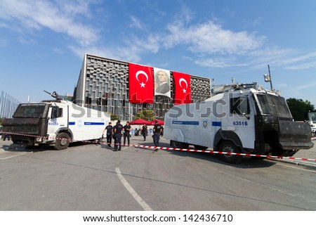 ISTANBUL - JUNE 15: Police force during protests in Turkey on June 15, 2013 in Istanbul, Turkey. Police evacuated Gezi Park by using disproportionate force and clashes until dawn.
