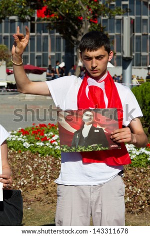 ISTANBUL - JUNE 22: Man makes silent protest in Taksim on June 22, 2013 in Istanbul, Turkey. After evacuation and occupation Gezi Park by police, people started silent demonstration in Turkey