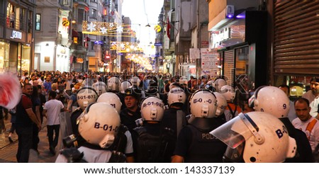 ISTANBUL - JUNE 22: Police intervention to protestors in Ã?Â?Ã?Â�stiklal Street on June 22, 2013 in Istanbul, Turkey. People came Taksim Square with red carnations to commemoration for dead during protests