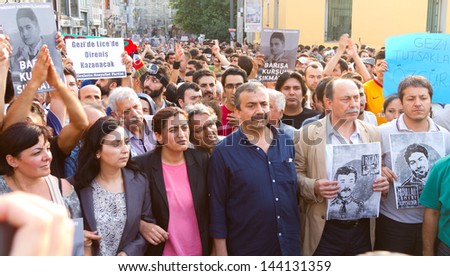 ISTANBUL - JUNE 29: Peace and Democracy Party parliamentarians in front of protestors on June 29, 2013 in Istanbul, Turkey. Gezi Park protests developed into anti-government demonstrations.