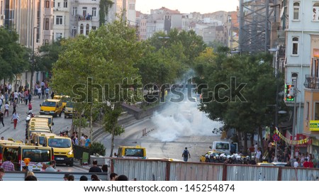 ISTANBUL - JULY 06: Tear gas in Tarlabasi Avenue during protests on July 06, 2013 in Istanbul, Turkey. People are protesting the prohibition of entry to Gezi Park since 15 June 2013