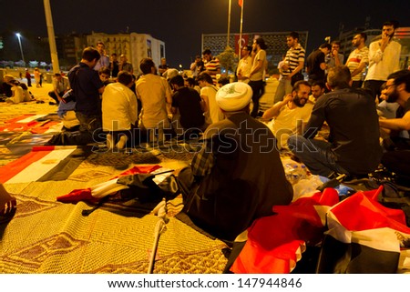 ISTANBUL - JULY 27: People gathered in Taksim Square to support Egypt's Ex-President Mohamed Morsi in Turkey on July 27, 2013 in Istanbul, Turkey.