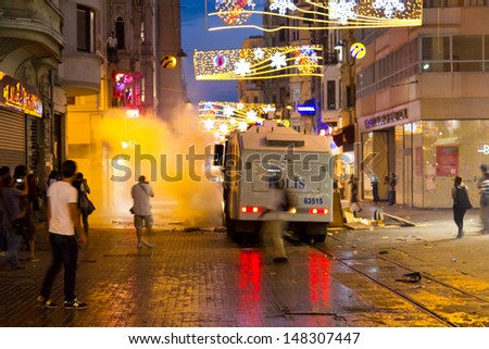 ISTANBUL - JULY 31: Riot Control Vehicle attack in Istiklal Street on July 31, 2013 in Istanbul, Turkey. People gathered and protest for Berkin Elvan who was shot in the head with a tear gas canister