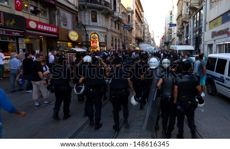 ISTANBUL - AUGUST 03: Riot Control Vehicle intervene protestors in Istiklal Street on August 03, 2013 in Istanbul, Turkey. Police intervene unorganized small groups of anti-government protestors.