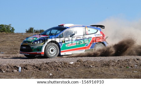 ISTANBUL - SEPTEMBER 28: Yagiz Avci drives Ford Fiesta S2000 of Castrol Ford Team Turkey in 42nd Bosphorus Rally Kadilli Stage on September 28, 2013 in Istanbul, Turkey.