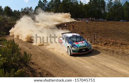 ISTANBUL - SEPTEMBER 29: Orhan Avcioglu drives Ford Fiesta S2000 of Castrol Ford Team Turkey in 42nd Bosphorus Rally Mudarli Stage on September 29, 2013 in Istanbul, Turkey.