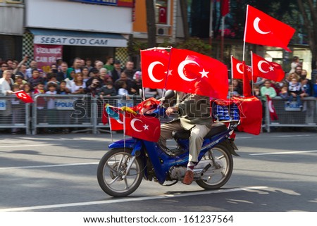ISTANBUL - OCTOBER 29: Motorized man with flags at Vatan Avenue during Republic Day celebration of Turkey on October 29, 2013 in Istanbul, Turkey.