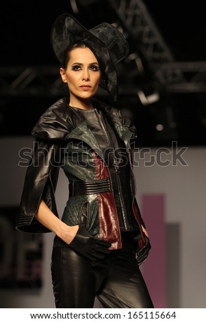 ISTANBUL - NOVEMBER 23: A model walks on the Temer Leather catwalk during 8th Istanbul Leather Fair runway on November 23, 2013 Istanbul, Turkey.