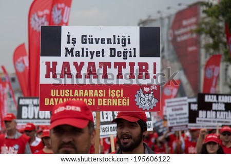 ISTANBUL, TURKEY - MAY 25, 2014: Unions march in protest against subcontractors in Turkey. Job security is not cost lives write on banner