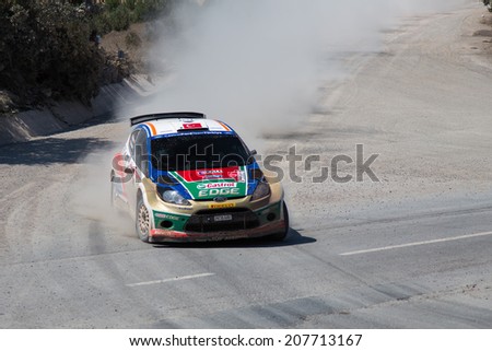 ISTANBUL, TURKEY - JULY 13, 2014: Murat Bostanci drives Ford Fiesta S2000 of Castrol Ford Team Turkey in 35. Istanbul Rally, Ulupelit ITO Stage