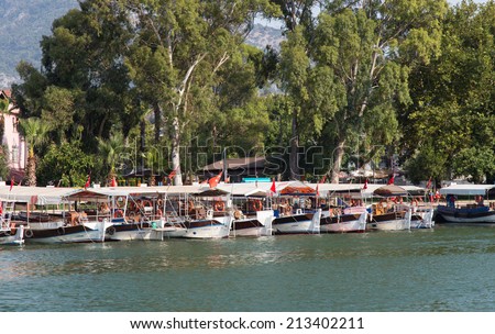 DALYAN, MUGLA, TURKEY - JULY 18, 2014: Tour boats in Dalyan river. River tour between Koycegiz lake and Iztuzu beach is one of the most populer activity in Dalyan.