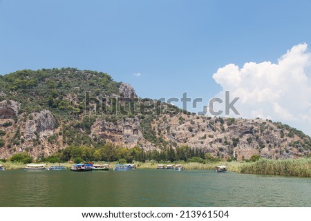 DALYAN, MUGLA, TURKEY - JULY 19, 2014: Tour boat in Dalyan river. River tour between Koycegiz lake and Iztuzu beach is one of the most populer activity in Dalyan.