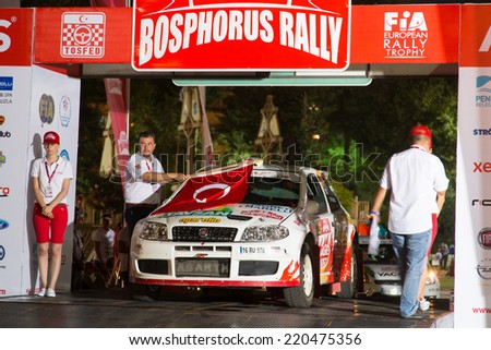 ISTANBUL, TURKEY - AUGUST 15, 2014: Murat Soycopur with Fiat Punto S1500 car of Pegasus Racing Team in ceremonial start of Avis Bosphorus Rally