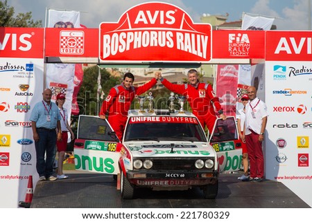 ISTANBUL, TURKEY - AUGUST 17, 2014: Burak Turkkan with Fiat 131 car of Bonus Unifree Parkur Racing Team in Podium Ceremony of Avis Bosphorus Rally