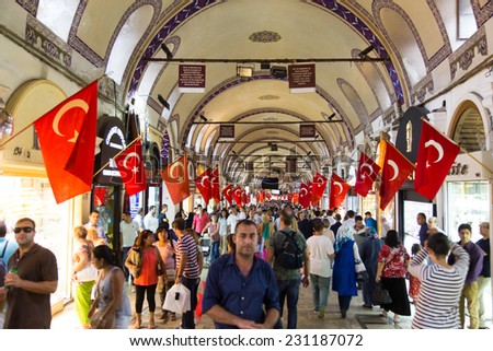 ISTANBUL, TURKEY - AUGUST 30, 2014: People shopping in the Grand Bazaar. The Grand Bazaar is one of the largest and oldest covered markets in the world.