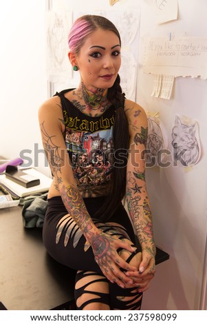 ISTANBUL, TURKEY - SEPTEMBER 20, 2014: Tattooists girl in Istanbul Tattoo Convention which held in Kadikoy.