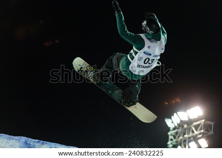 ISTANBUL, TURKEY - DECEMBER 20, 2014: Jonas Boesiger jump in FIS Snowboard World Cup Big Air. This is first Big Air event for both, men and women.