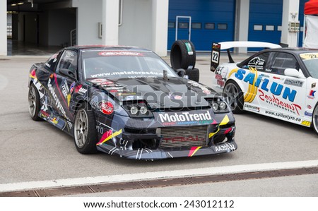 ISTANBUL, TURKEY - OCTOBER 11, 2014: Drift car in garage area of Istanbul Park circuit during FIA World Rallycross Championship.