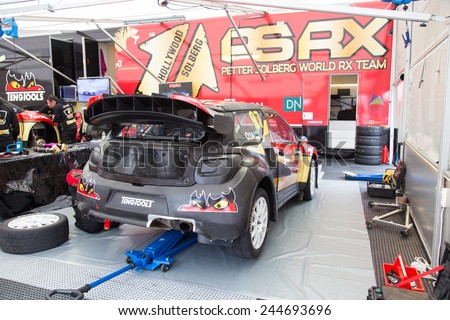 ISTANBUL, TURKEY - OCTOBER 11, 2014: Sten Oja with Citroen DS3 of Petter Solberg World RX Team in garage area of Istanbul Park circuit during FIA World Rallycross Championship.