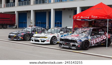 ISTANBUL, TURKEY - OCTOBER 11, 2014: Drift cars in garage area of Istanbul Park circuit during FIA World Rallycross Championship.