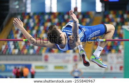 ISTANBUL, TURKEY - FEBRUARY 21, 2015: Greek athlete Antonios Merlos high jump during Balkan Athletics Indoor Championships in Asli Cakir Alptekin Athletics hall.