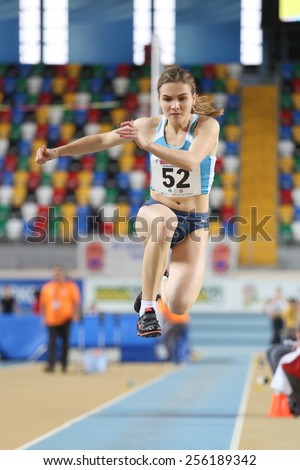 ISTANBUL, TURKEY - FEBRUARY 21, 2015: Moldovan athlete Natalia Cipilencu triple jump during Balkan Athletics Indoor Championships in Asli Cakir Alptekin Athletics hall.
