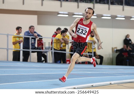 ISTANBUL, TURKEY - FEBRUARY 21, 2015: Turkish athlete Hasan Basri Guduk running during Balkan Athletics Indoor Championships in Asli Cakir Alptekin Athletics hall.